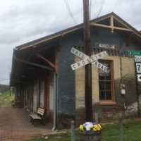The rail line might be gone, but signs of it aren't in town