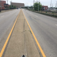 The slim median between highways makes for one interesting walk