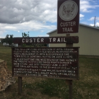 A sign marking Custer's passage through the town of Sentinel Butte in 1876