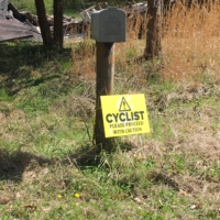The world, the road, it wasn't made for cyclists. I am more grateful than I can say for signs like this, that seem to say "You are seen," even if those words are followed by "please, proceed with caution . . ."