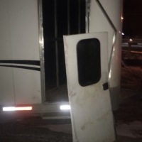 On our way home to PA from the adoption center in TN, the mustangs nearly escaped as one of our trailer doors got knocked off its hinges when they crashed into it.