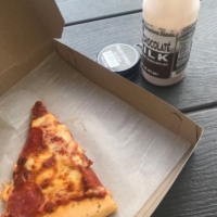 Pizza and chocolate milk are my go-to guilty pleasure foods at gas stations on the road.