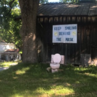 I love random roadside oddities. "Keep smiling behind the mask."